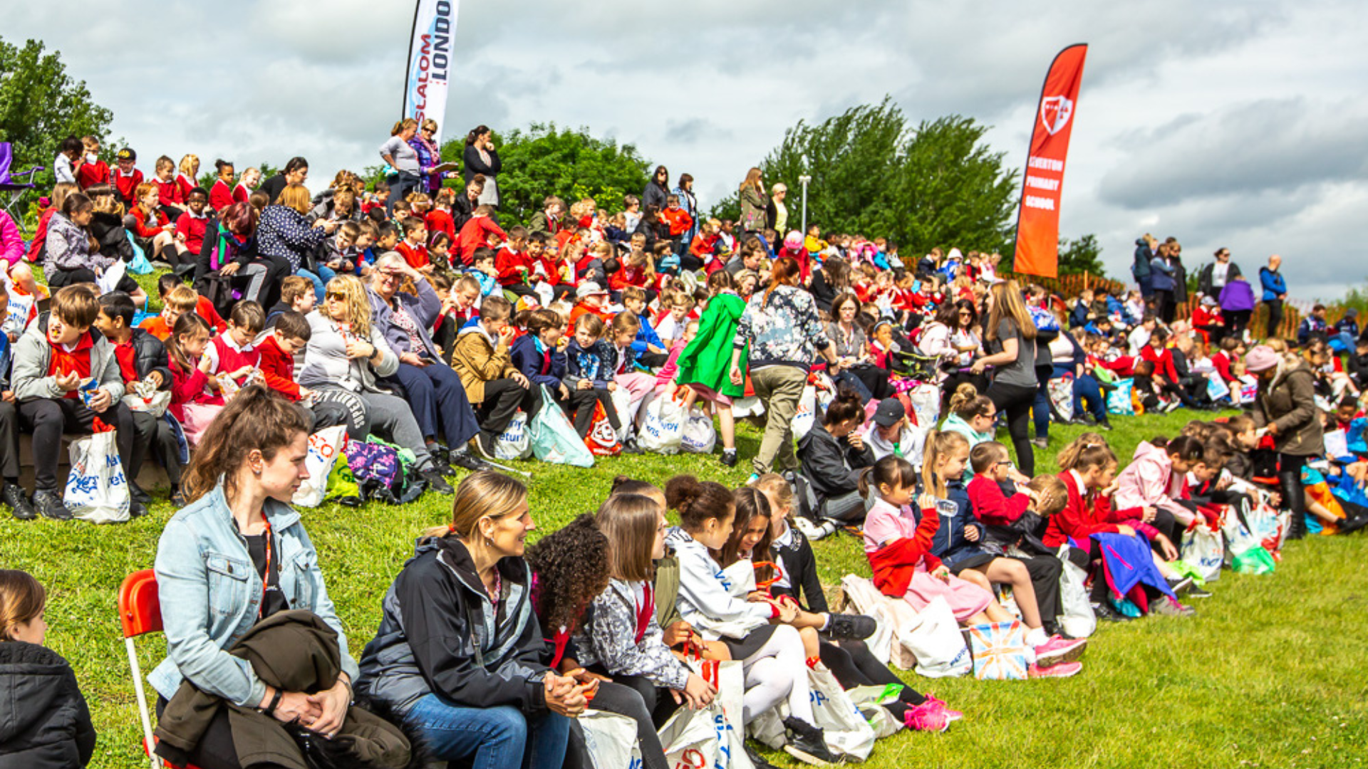Crowd of people watching a paddling event.