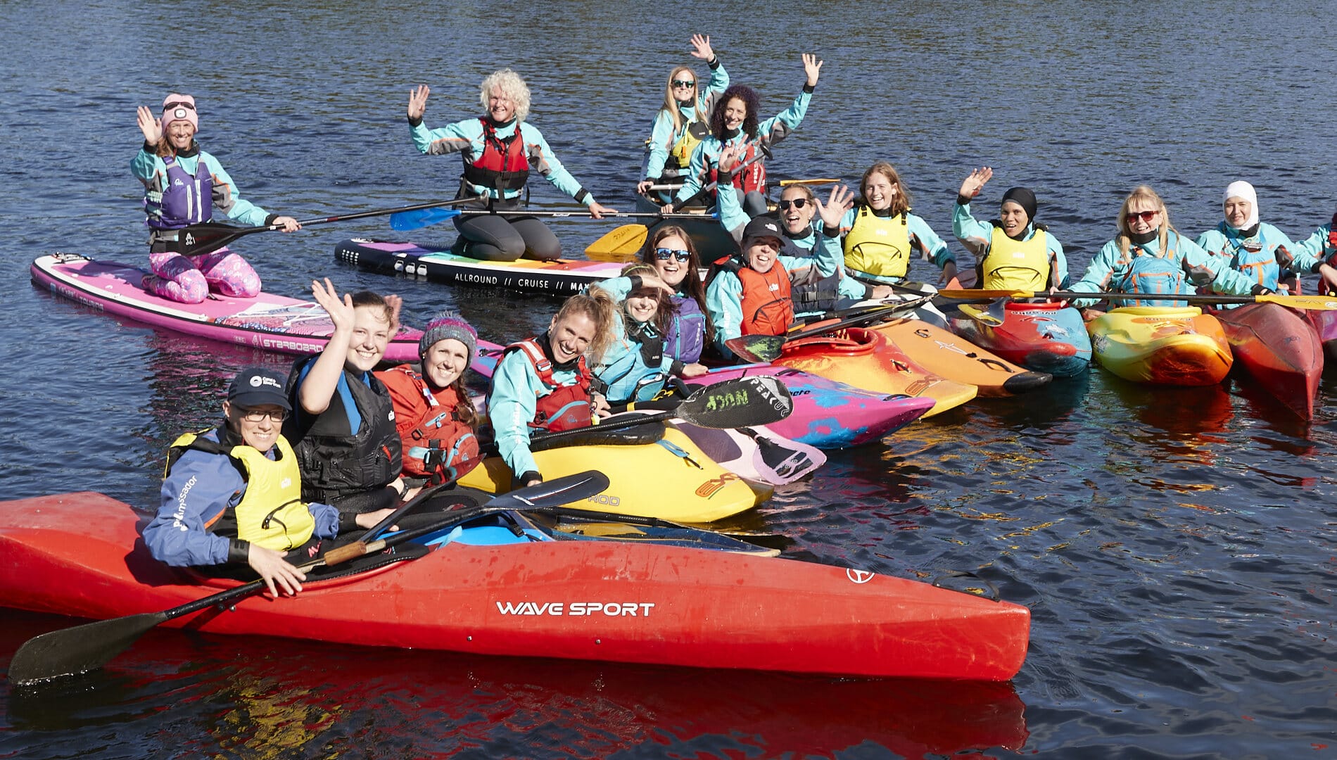 A mix of paddlers in kayaks. Use for event toolkit compliance page.