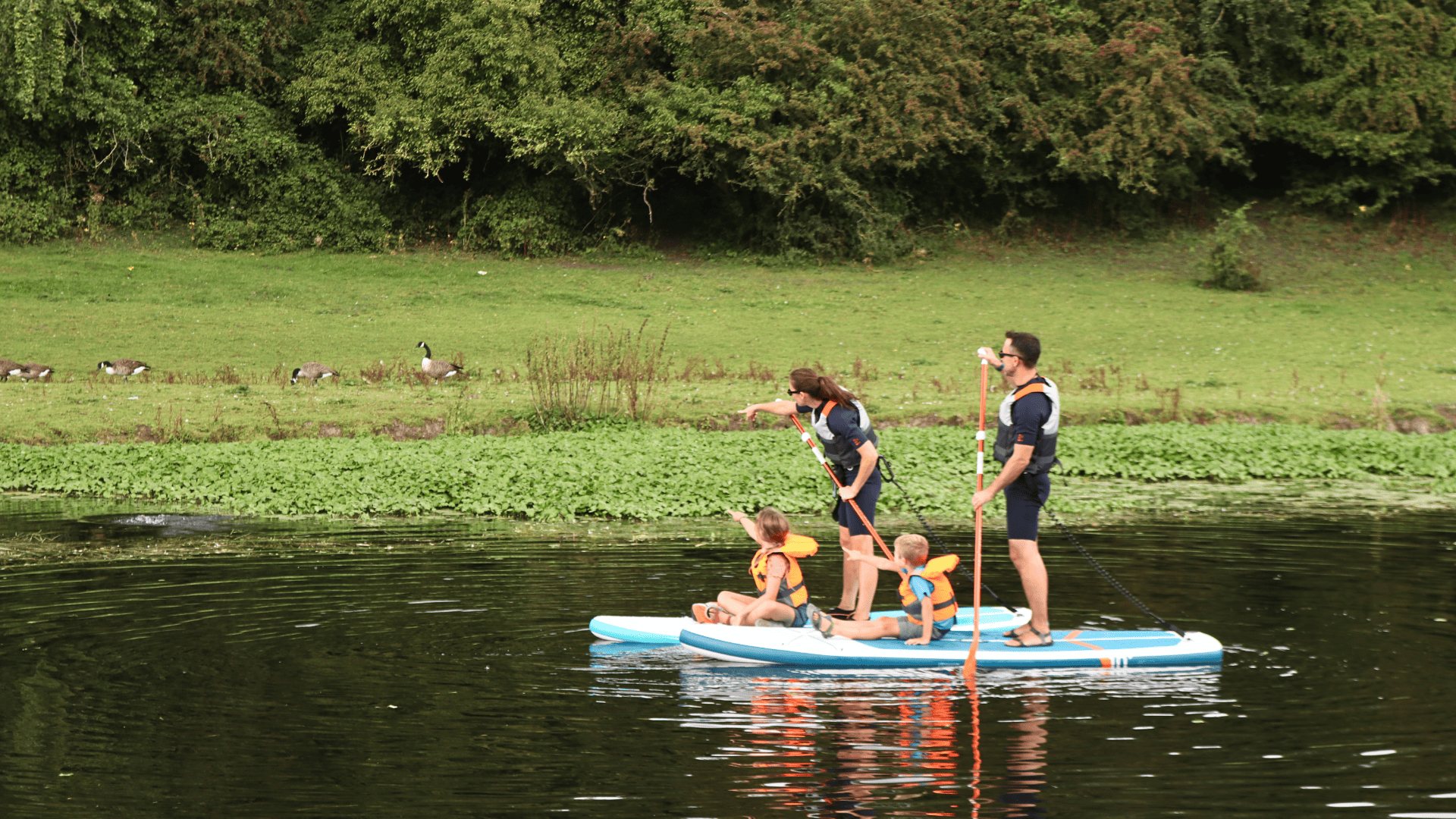 Family on paddleboard at Broadways Meadow