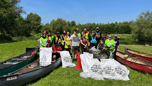 Paddlers with Big Paddle Cleanup bags. Supporting green spaces.