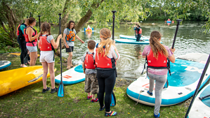 Coach with young paddlers.