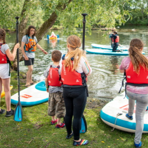 Coach with young paddlers.
