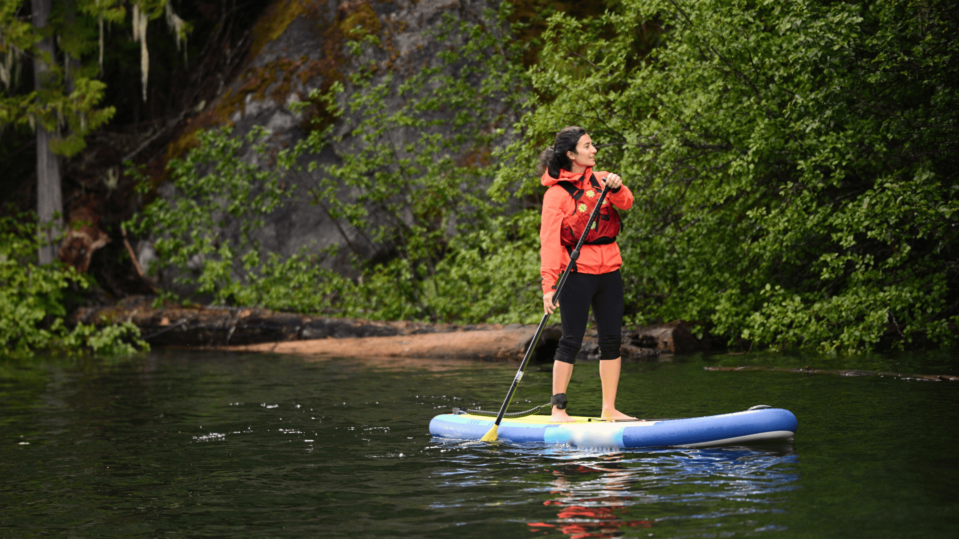 Woman on a stand up paddle board. On the Bank
