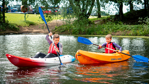Two young boys paddling. How to affiliate your club.