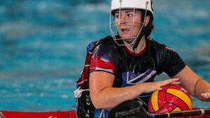 Woman playing canoe polo.