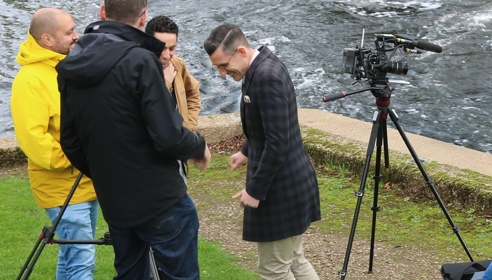Video camera on tripod and journalists. Used on event toolkit marketing and media page.