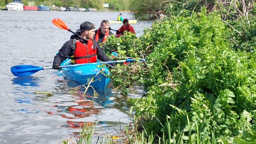 Paracanoe team picking out rubbish