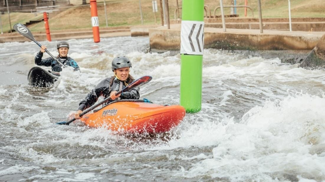People competing in a kayak cross event