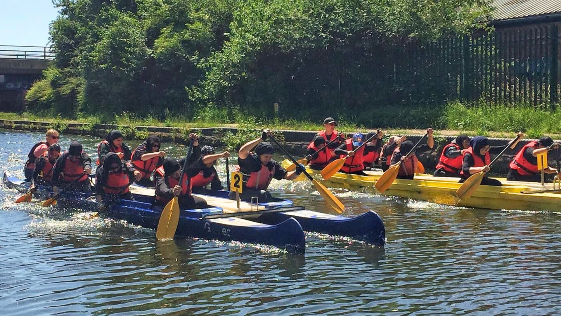 Birmingham Women's Regatta 2024 participants racing in bell boats.