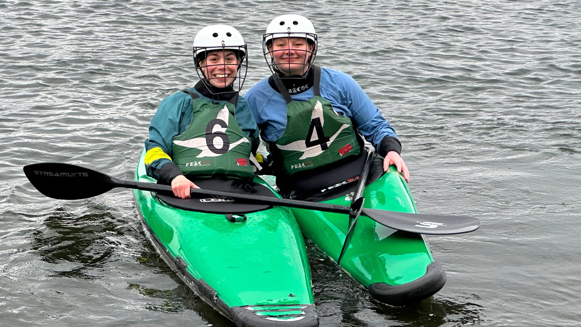 Eleanor Addison #ShePaddles Ambassador playing canoe polo with team mate