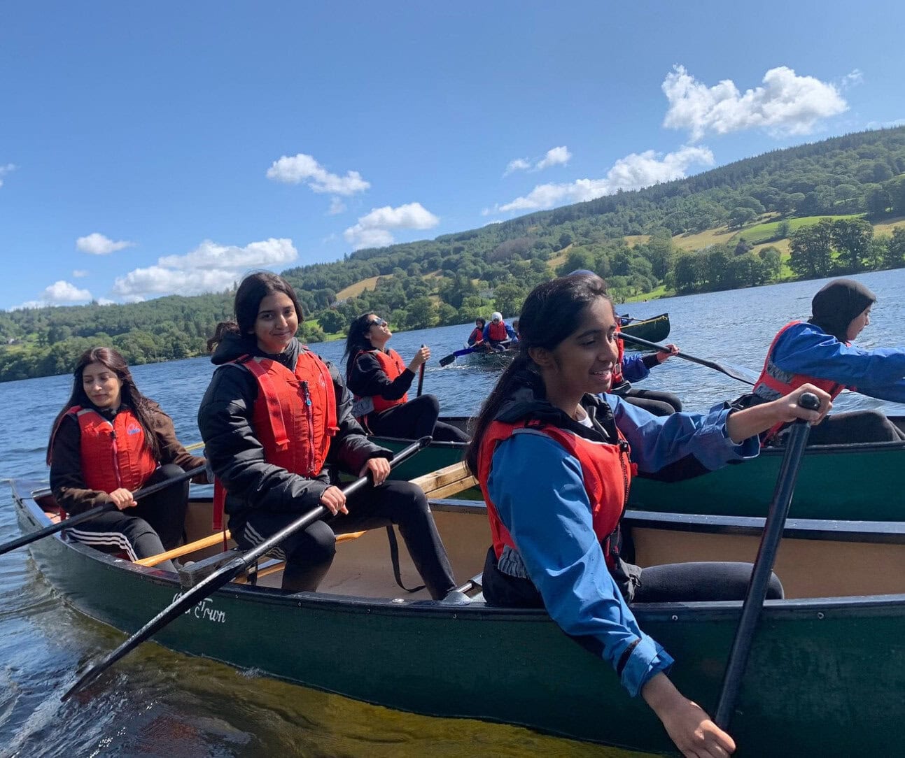 Muslim Scout female group canoeing in the Lake District