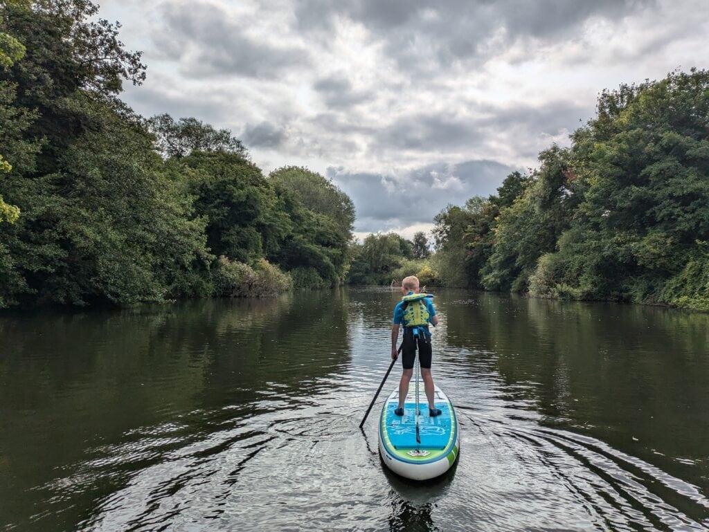 Child stand up paddle boarding