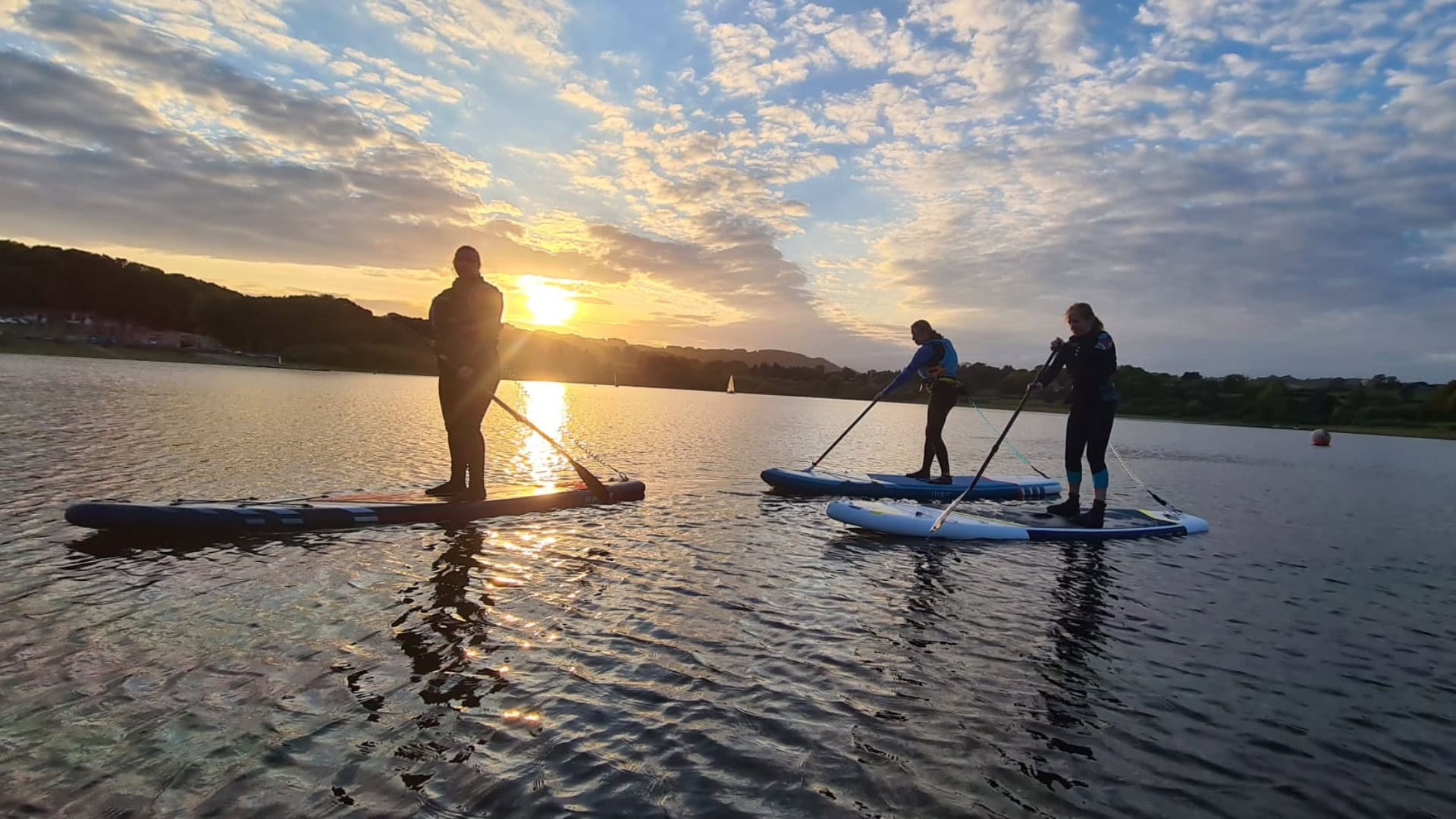 Kate Allatt paddleboarding with friends at Ogston Sailing Club
