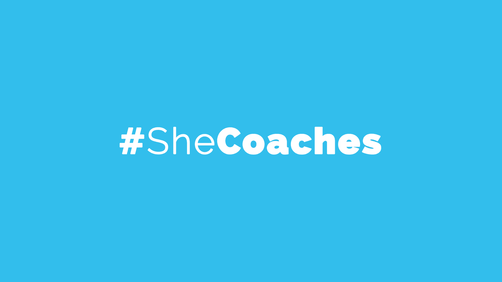 #SheCoaches logo on blue background