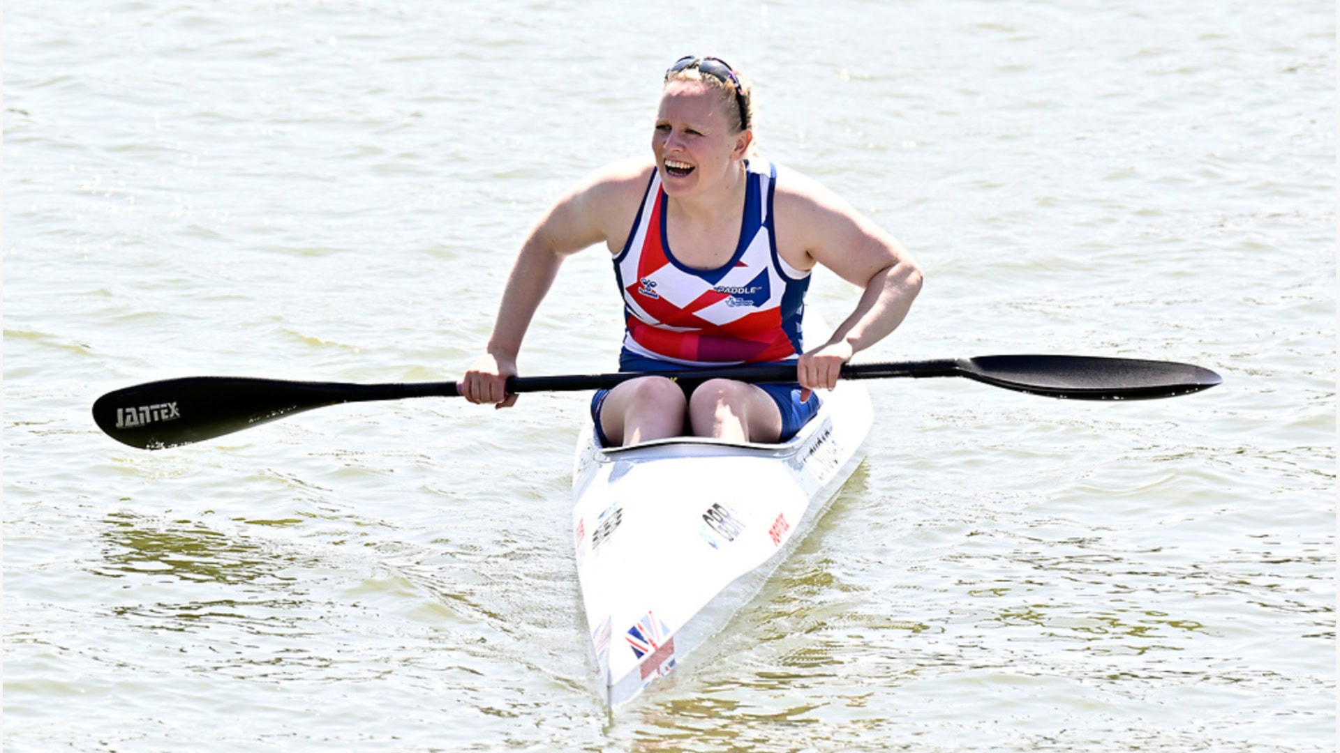 Laura Sugar in her kayak and smiling