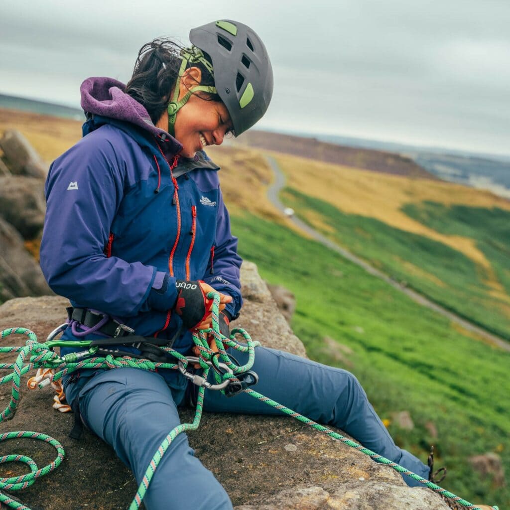 Climber checks her ropes by Veronica Melkonian 