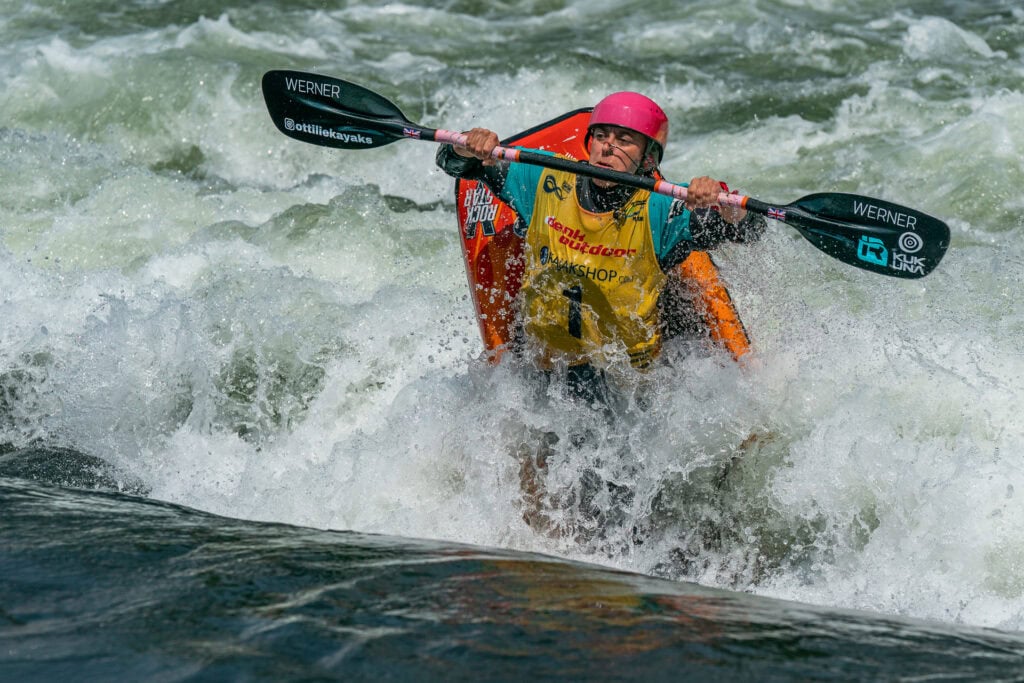 A British athlete competing in squirt boating.