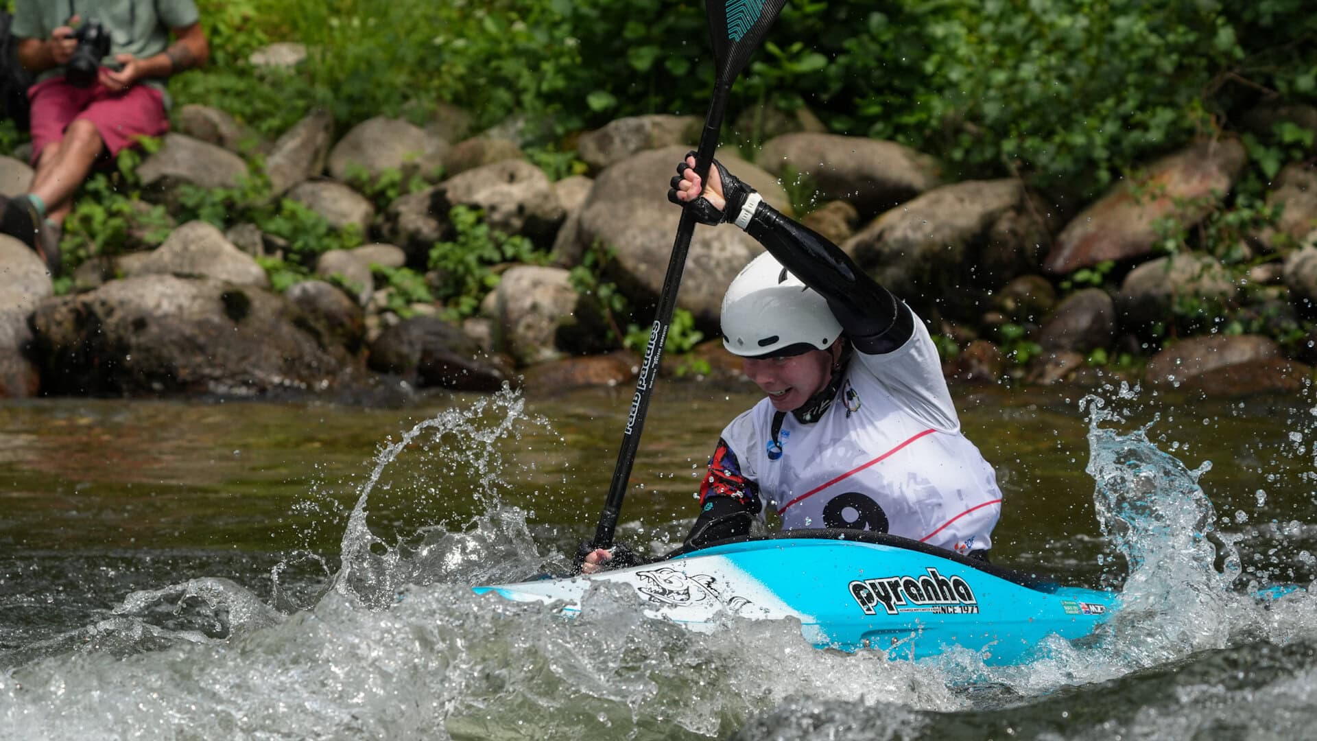 Lois Leaver charges through kayak cross at Foix.