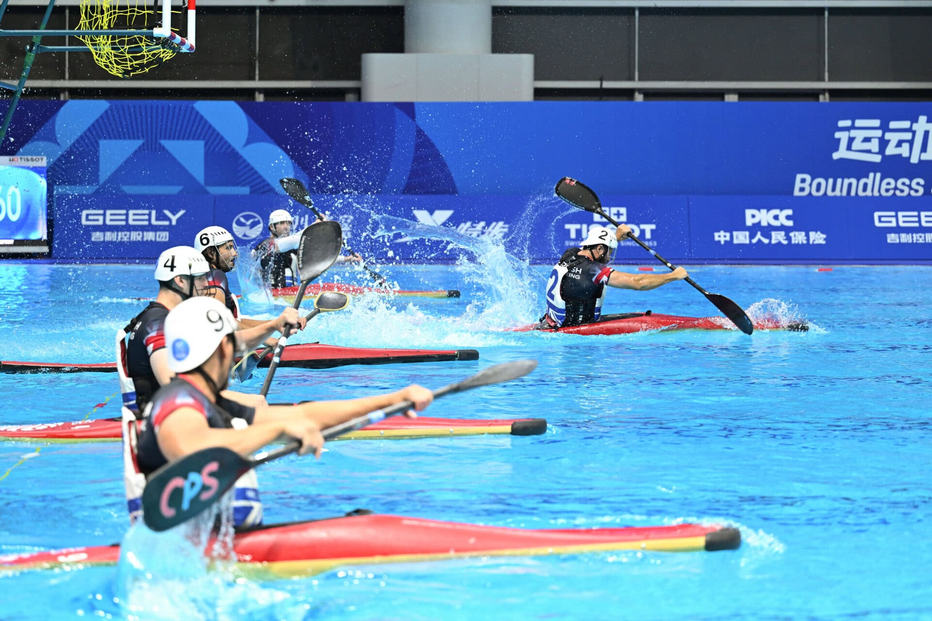 Athletes in kayaks preparing for the first canoe polo sprint
