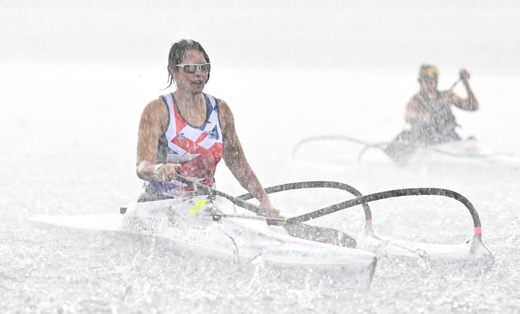 Jeanette Chippington (GBR) appears through the hail stones in the Womens VL2 200m during the 2025 Sprint and Para Canoe World Championships at Idroscalo Regatta Course, Italy.
