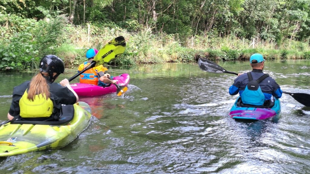 Paddlers in a blue space