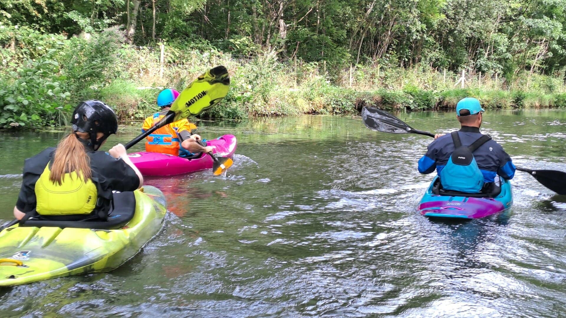 Paddlers in a blue space