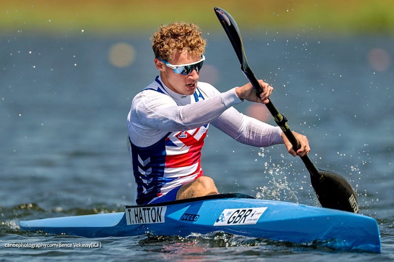 Tom Hatton paddling hard across a lake in Montemor-o-Velho, Portugal.