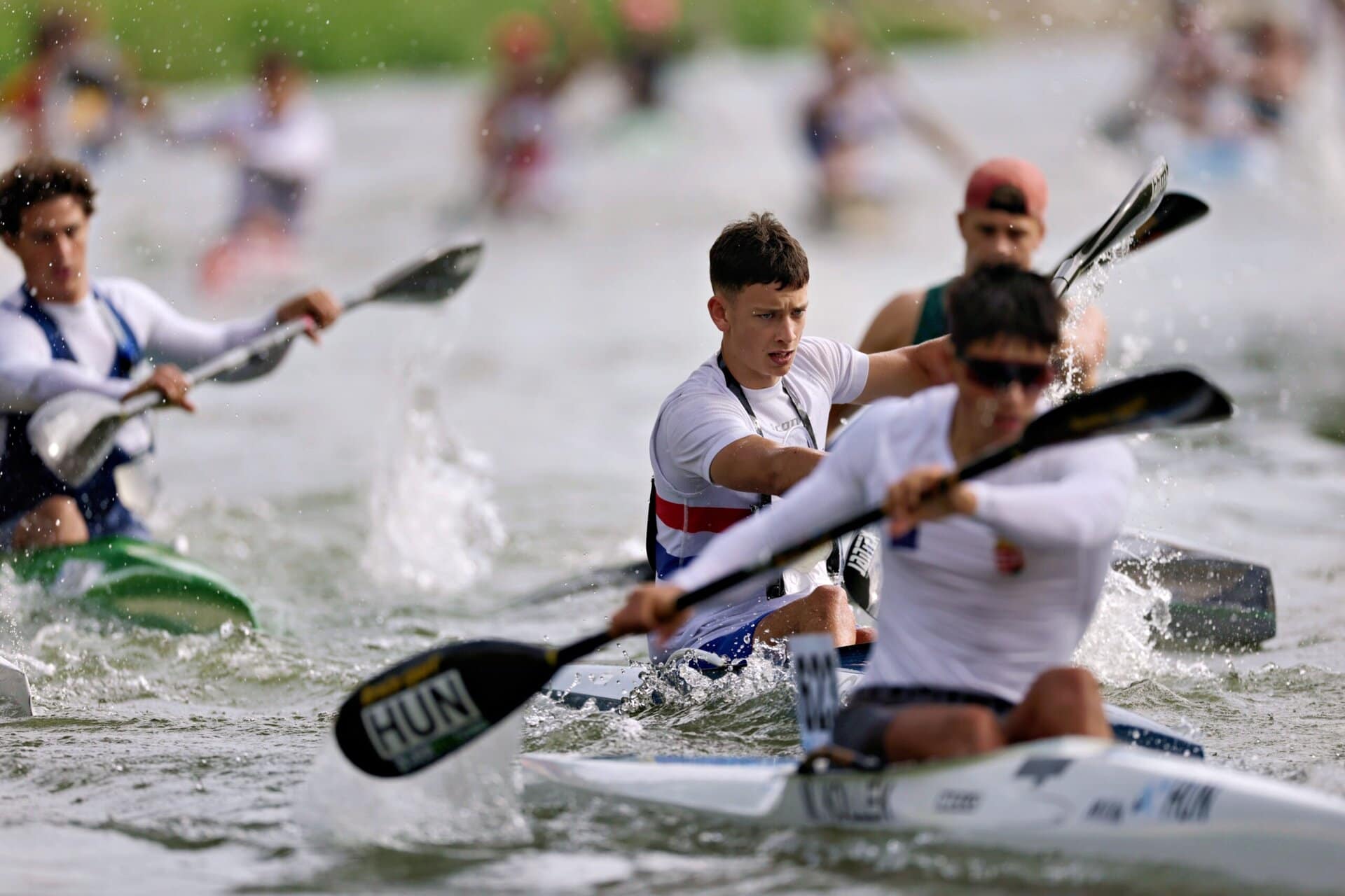 Will Short paddling hard across flat water amongst competitors.