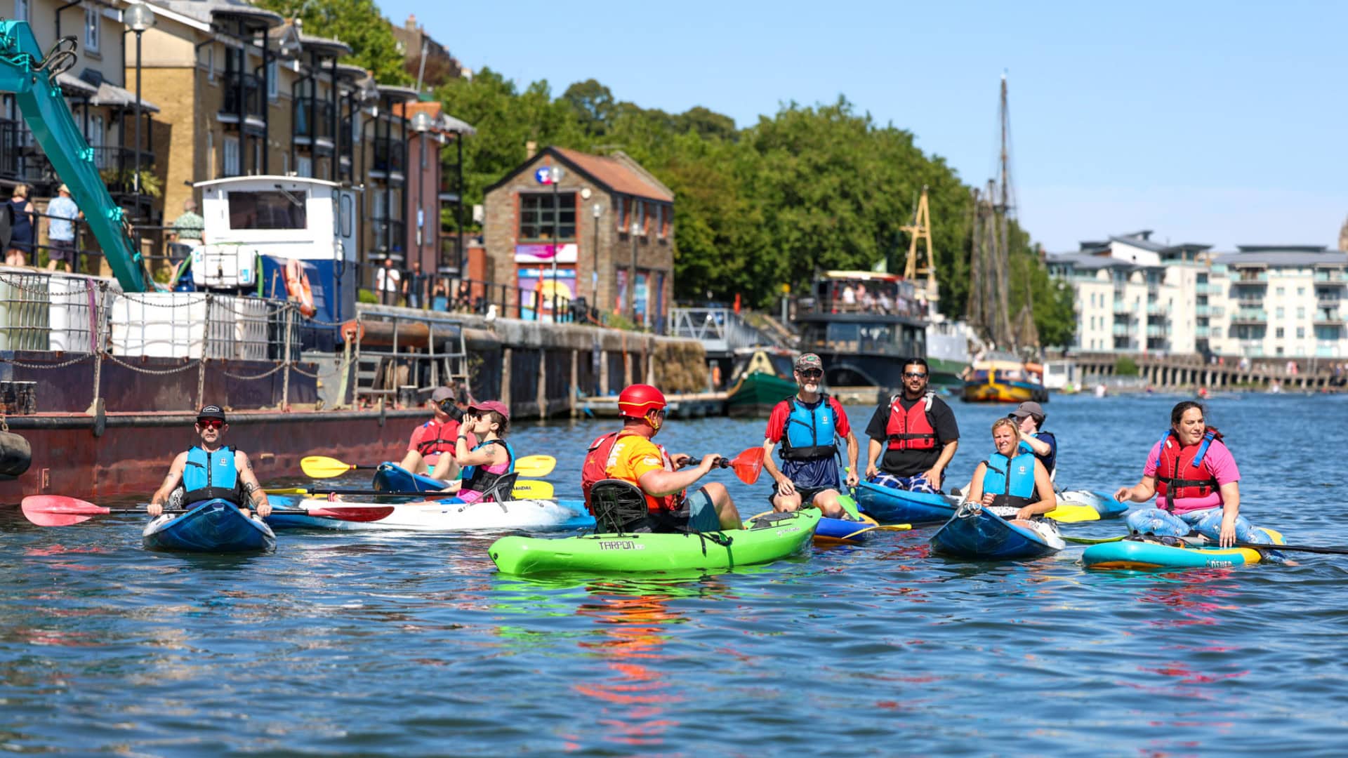 All Aboard Bristol Deaf Watersports Instructor Oliver Richardson with group of kayakers and paddleboarders