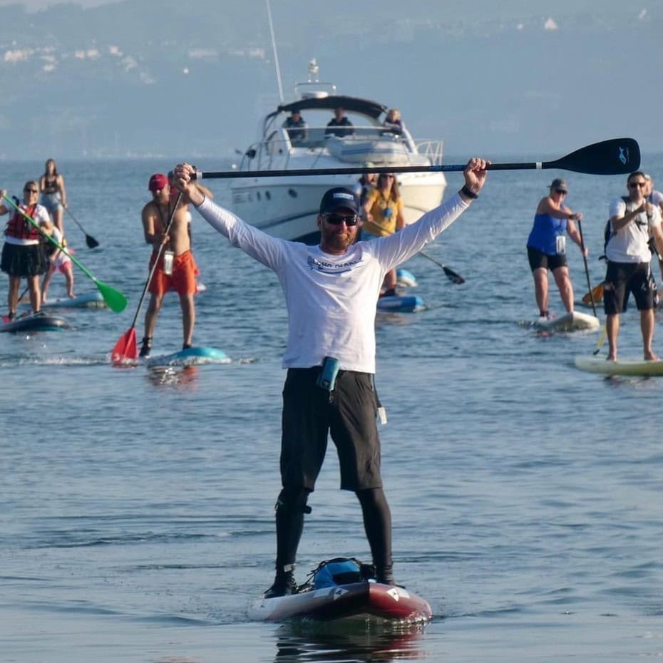 Picture of Brendon Prince with paddlers in the background