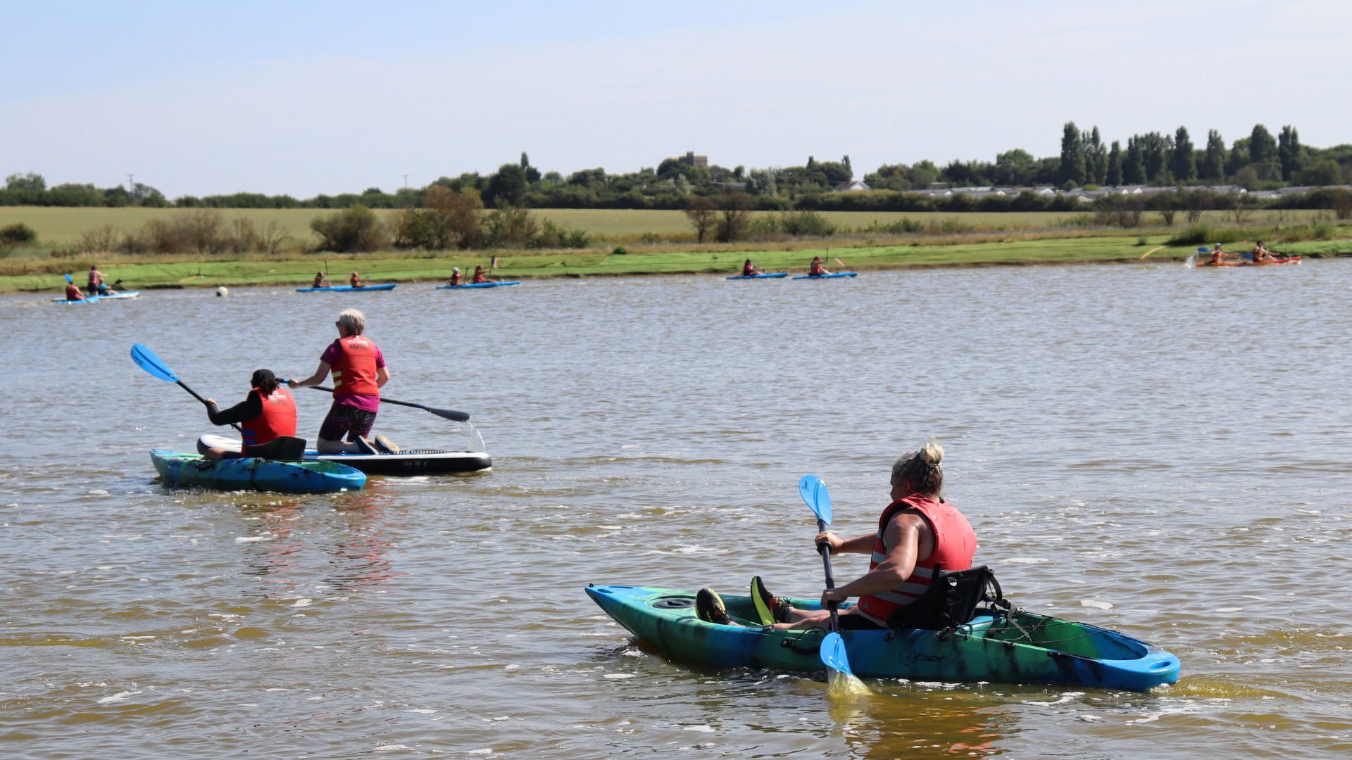 Group of female kayakers at Mersea Water Park as part of the #ShePaddles Weekender 2025