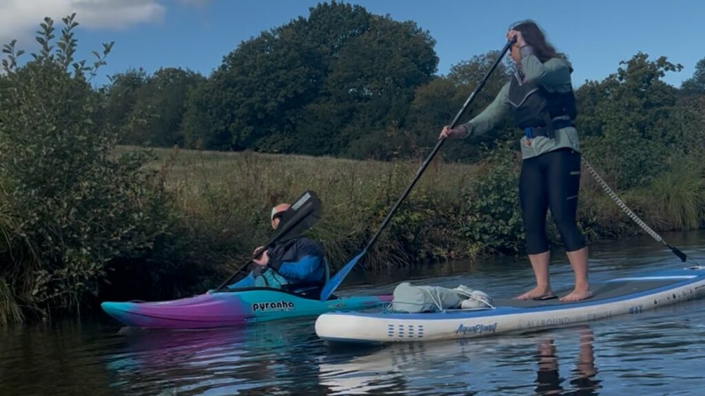 Kayaker and paddleboarder