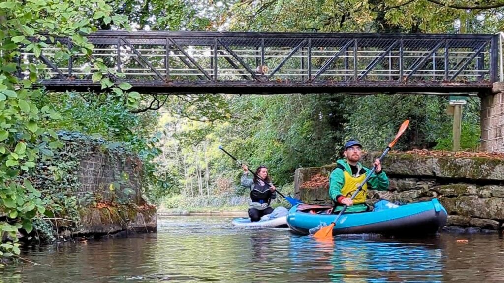 Peak Forest paddlers going under a bridge